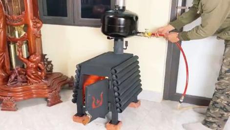 农村自制小型柴火取暖炉视频
